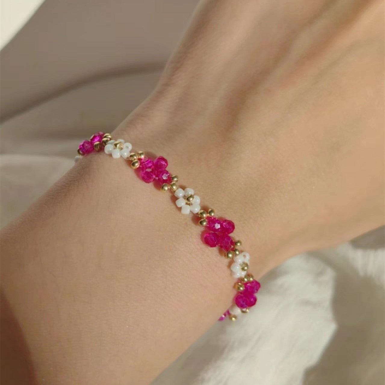 white-beaded-bracelet-with-red-crystal